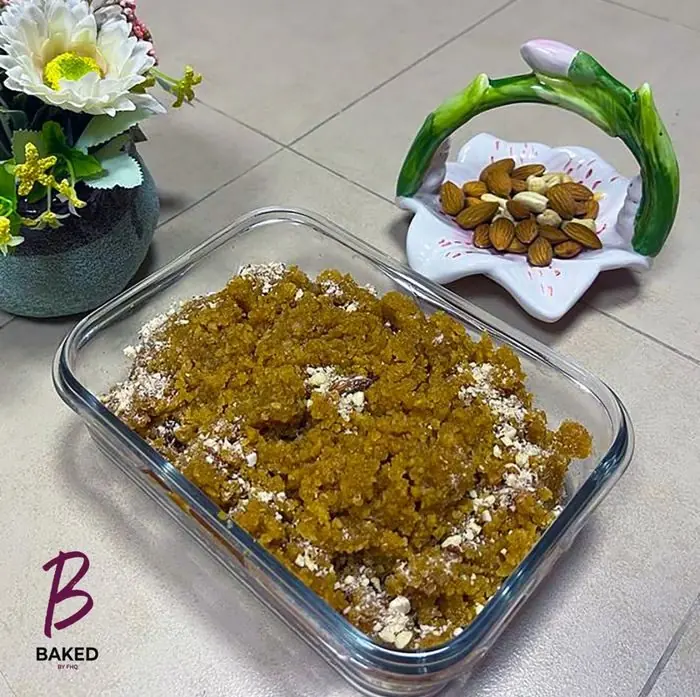 A 2023 Baked by FHQ post: a photo of halwa in a glass dish with the logo in the corner